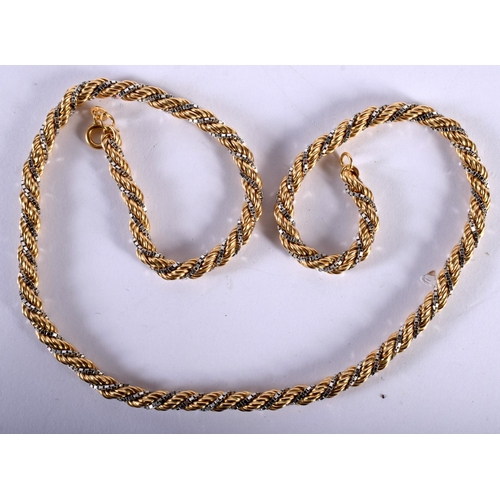 1233 - An 18ct Two Tone Gold Rope Necklace.  Stamped 18K, Length 50cm, weight 32.3g