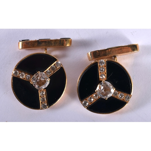 1241 - A Pair of Gold Cufflinks Set with Diamonds on Black Onyx.  2.1cm diameter, total weight 20.5g