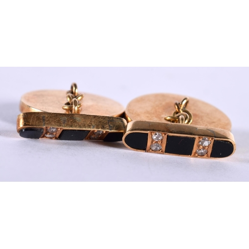 1241 - A Pair of Gold Cufflinks Set with Diamonds on Black Onyx.  2.1cm diameter, total weight 20.5g