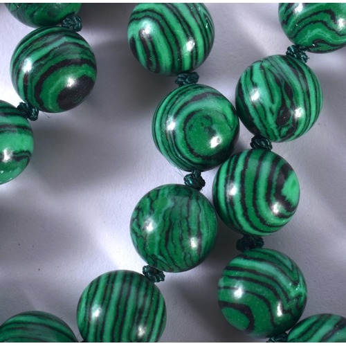 1438 - A Malachite Bead Necklace.  88cm long, Bead size 10.1mm, weight 96.7g