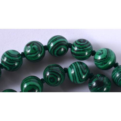 1438 - A Malachite Bead Necklace.  88cm long, Bead size 10.1mm, weight 96.7g