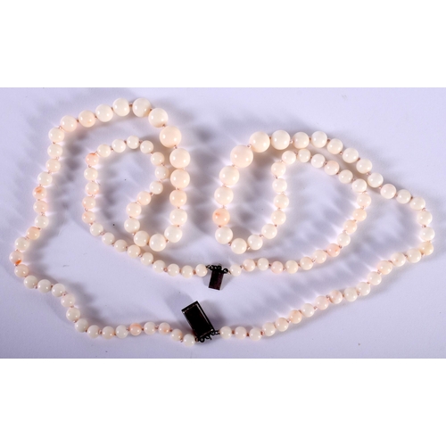 1439 - A White Coral Double Strand Necklace with Silver Clasp.  Stamped Sterling.  Length 44cm, Largest Bea... 