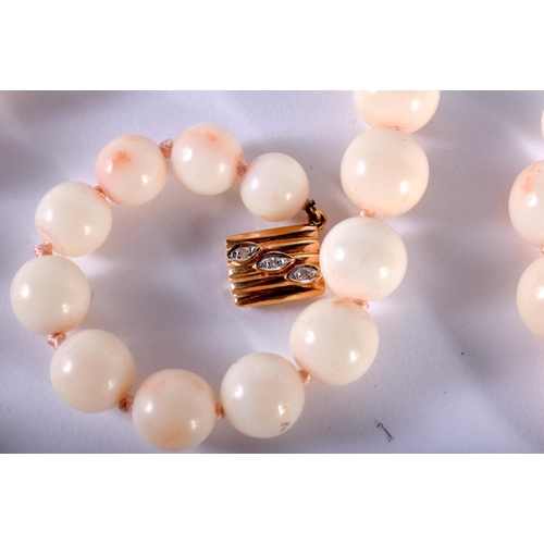 1440 - A White Coral Graduated Necklace with 14ct Gold Clasp.  Stamped 14K.  Length 59cm, Largest Bead 10.6... 