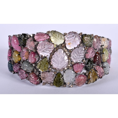 1452 - A Carved Tourmaline Bracelet.  19.5cm x 3cm, weight 41.5g