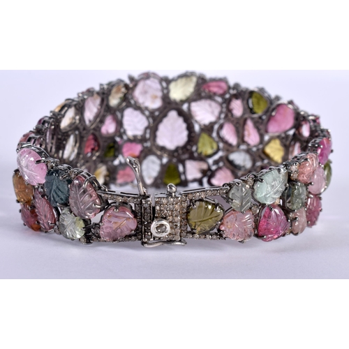 1452 - A Carved Tourmaline Bracelet.  19.5cm x 3cm, weight 41.5g