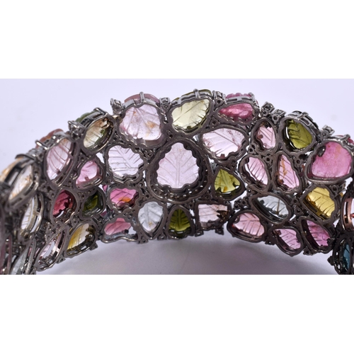 1452 - A Carved Tourmaline Bracelet.  19.5cm x 3cm, weight 41.5g