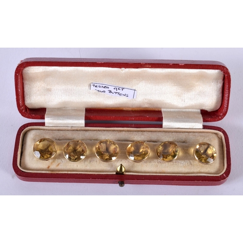 1729 - A Cased set of Six 9ct Gold Mounted Citrine Buttons.  1cm diameter