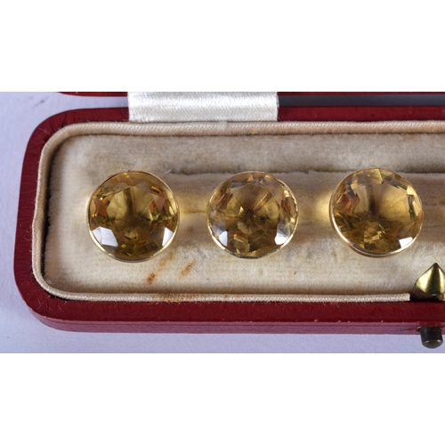 1729 - A Cased set of Six 9ct Gold Mounted Citrine Buttons.  1cm diameter