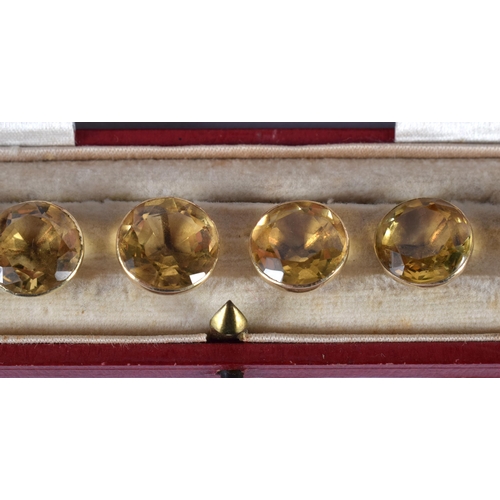 1729 - A Cased set of Six 9ct Gold Mounted Citrine Buttons.  1cm diameter