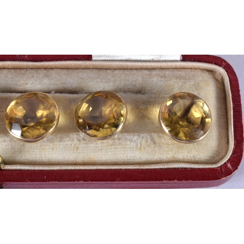 1729 - A Cased set of Six 9ct Gold Mounted Citrine Buttons.  1cm diameter