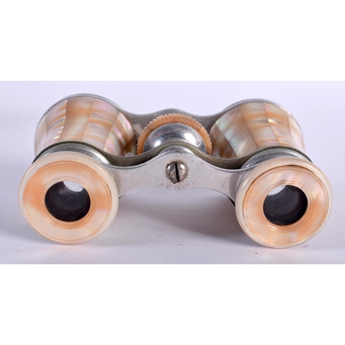 1999 - A Cased Pair of Mother of Pearl Opera Glasses. 10cm x 5.5cm