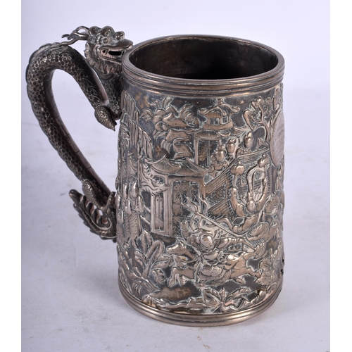 2001 - A LATE 19TH CENTURY CHINESE EXPORT SILVER DRAGON MUG decorative in relief with figures, bearing mili... 