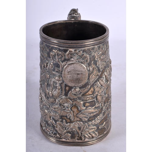 2001 - A LATE 19TH CENTURY CHINESE EXPORT SILVER DRAGON MUG decorative in relief with figures, bearing mili... 