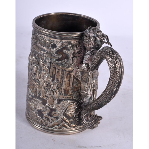 2001 - A LATE 19TH CENTURY CHINESE EXPORT SILVER DRAGON MUG decorative in relief with figures, bearing mili... 