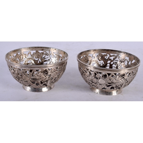 2003 - A PAIR OF LATE 19TH CENTURY CHINESE EXPORT SILVER DRAGON BOWLS by Luen Wo. 7.75 cm diameter.