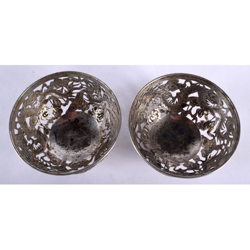 2003 - A PAIR OF LATE 19TH CENTURY CHINESE EXPORT SILVER DRAGON BOWLS by Luen Wo. 7.75 cm diameter.