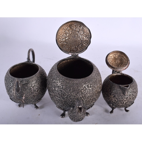 2007 - A 19TH CENTURY INDIAN SILVER THREE PIECE TEASET decorative in relief with foliage and vines. 790 gra... 