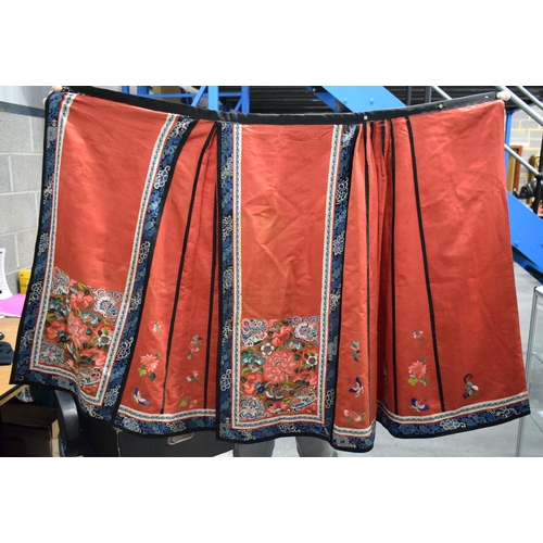 2825 - A LATE 19TH CENTURY CHINESE SILK EMBROIDERED RED GROUND SKIRT Qing. 230 cm x 80 cm.