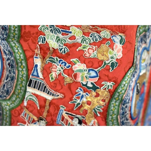 2831 - A LATE 19TH CENTURY CHINESE RED EMBROIDERED SILK SKIRT Late Qing, depicting assorted landscapes and ... 