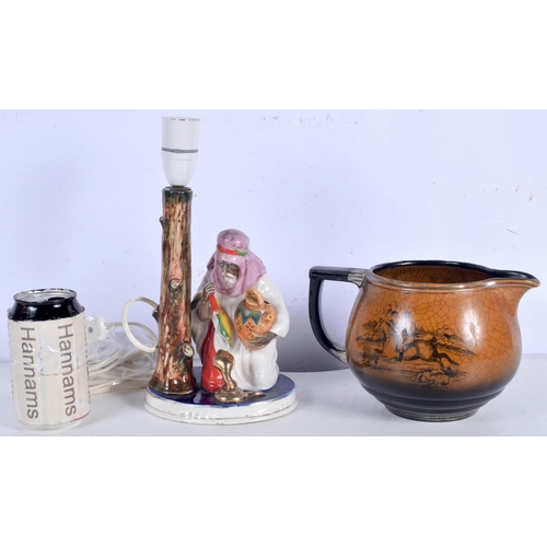 3004 - An antique Arthur Woods hunting themed jug together with a Continental porcelain snake charmer lamp ... 