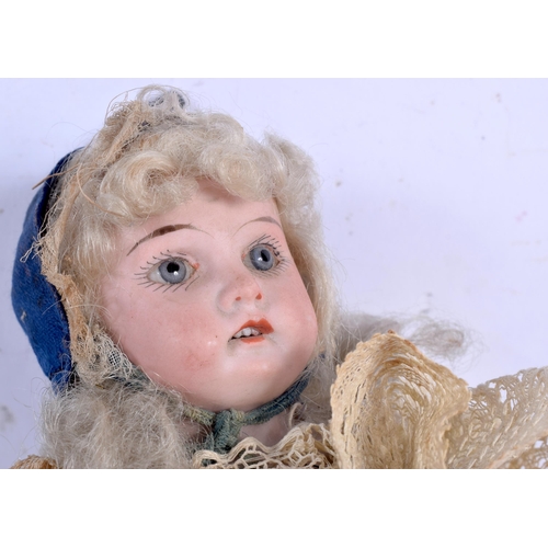 3013 - A Victorian Marotte spinning Bisque head doll 36 cm.