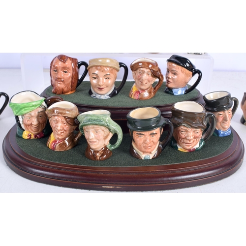 3016 - A collection of Miniature Royal Doulton Character jugs together with a stand (Qty)