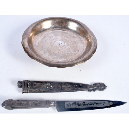 3018 - A Continental Silver dish together with a Stainless steel knife with an embossed sheath decorative w... 