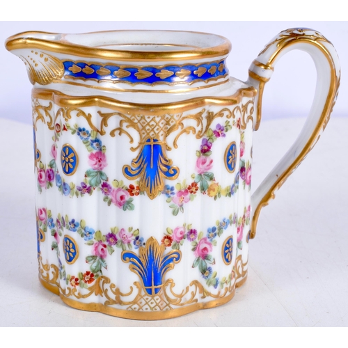 3019 - A Sevres style porcelain  milk jug decorative with flowers and gilt scrolling 9 cm.