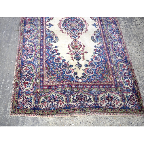 3026 - A Persian Kirman 215 x 123 cm.