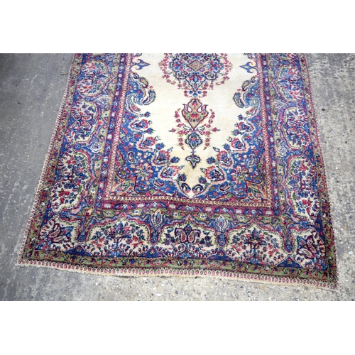 3026 - A Persian Kirman 215 x 123 cm.