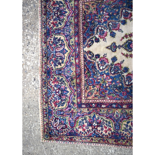 3026 - A Persian Kirman 215 x 123 cm.