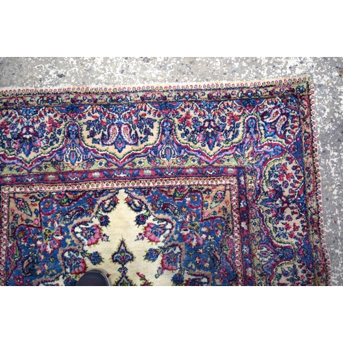 3026 - A Persian Kirman 215 x 123 cm.