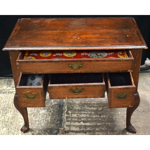 3058 - A GEORGE II OAK CROSSBANDED SIDE TABLE C1740 with four drawers. 83 cm x 70 cm x 46 cm.