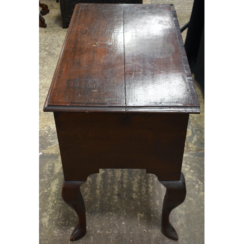 3058 - A GEORGE II OAK CROSSBANDED SIDE TABLE C1740 with four drawers. 83 cm x 70 cm x 46 cm.