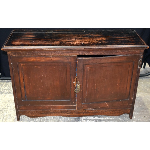 3062 - A STAINED WOOD TWO DOOR CABINET. 105 cm x 70 cm x 35 cm.