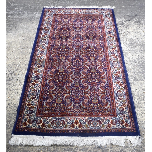 3168 - A blue ground Oriental rug 175 x 90cm.