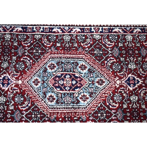 3169 - A Persian red ground runner 300 x 78cm.