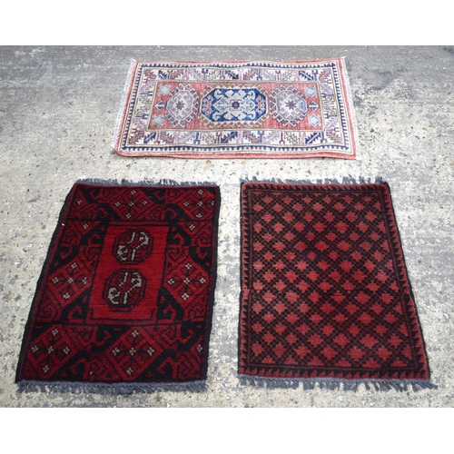 3171 - A Afghan prayer rug together with two other prayer rugs, largest 80 x 54cm.(3)