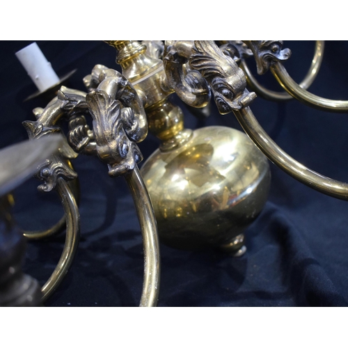 3187 - A brass eight arm chandelier 52 x 64cm.