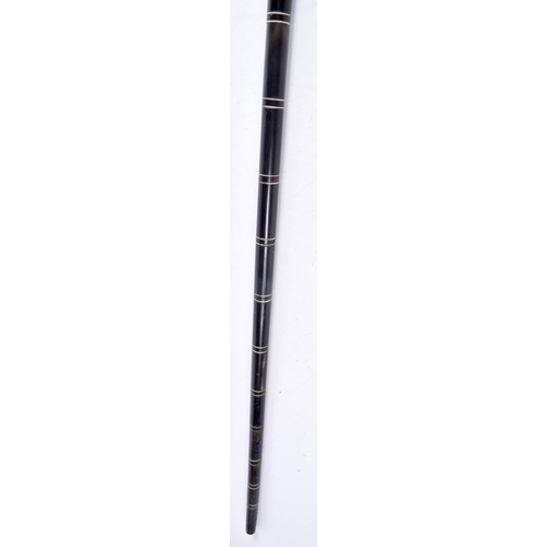 3338 - A carved Ebony and  horn handled  walking cane 85 cm