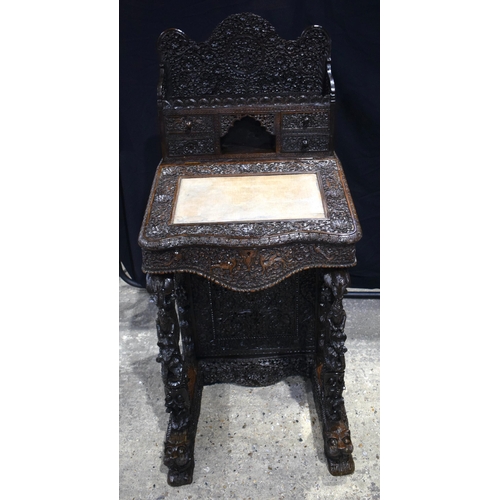 3342 - A 19th Century Lavishly carved wood Anglo Indian Davenport with carved snake Pillars  cm