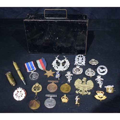 3724 - A collection of Militaria , cap badges, medals , Trench art pen ,lighter Etc (24).
