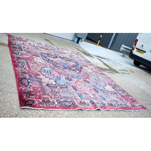 3748 - A large Oriental  figural rug 380 x 116 cm