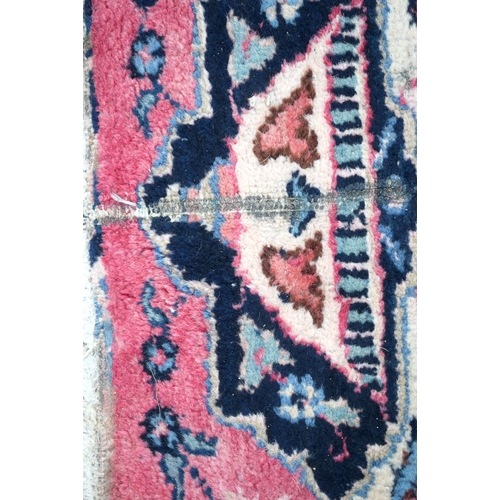 3748 - A large Oriental  figural rug 380 x 116 cm