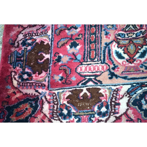 3748 - A large Oriental  figural rug 380 x 116 cm