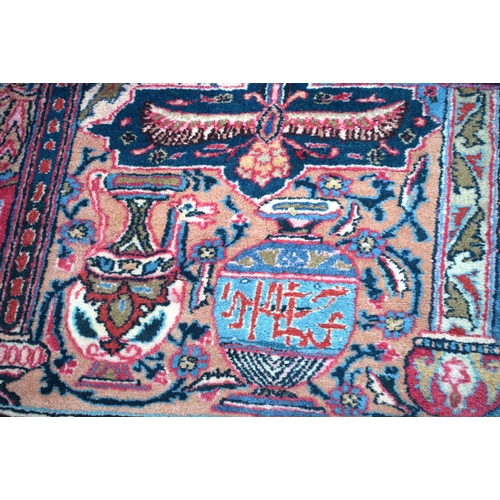 3748 - A large Oriental  figural rug 380 x 116 cm