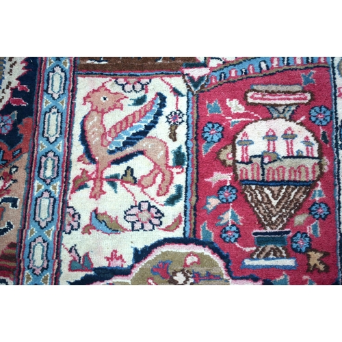 3748 - A large Oriental  figural rug 380 x 116 cm