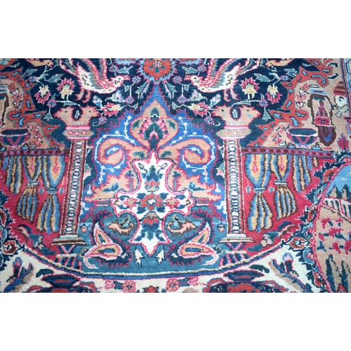 3748 - A large Oriental  figural rug 380 x 116 cm