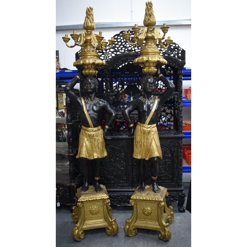 3753 - A FINE LARGE PAIR OF 19TH CENTURY ITALIAN CARVED AND GILDED WOOD BLACKAMOORS modelled holding aloft ... 