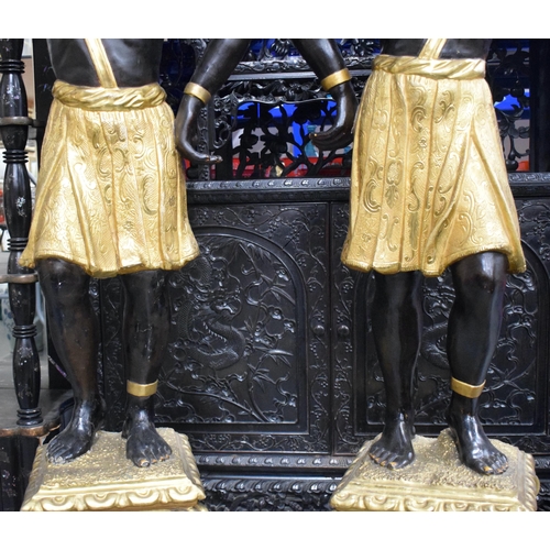 3753 - A FINE LARGE PAIR OF 19TH CENTURY ITALIAN CARVED AND GILDED WOOD BLACKAMOORS modelled holding aloft ... 